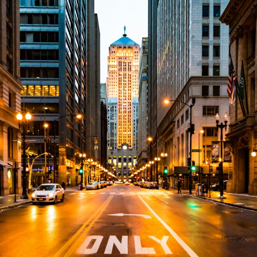 lighted roadway surrounded with buildings